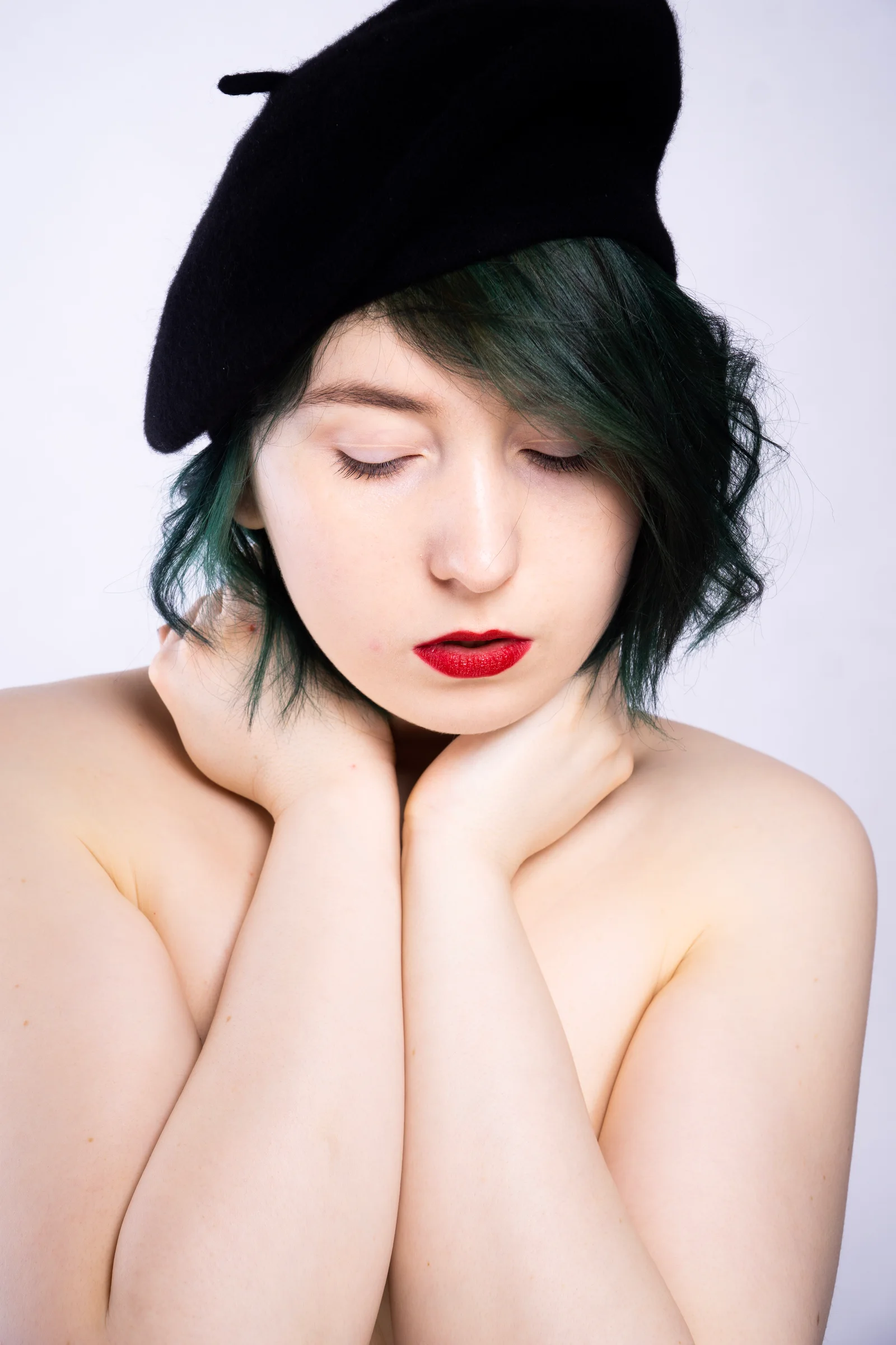 Editorial portrait black beret red lipstick
