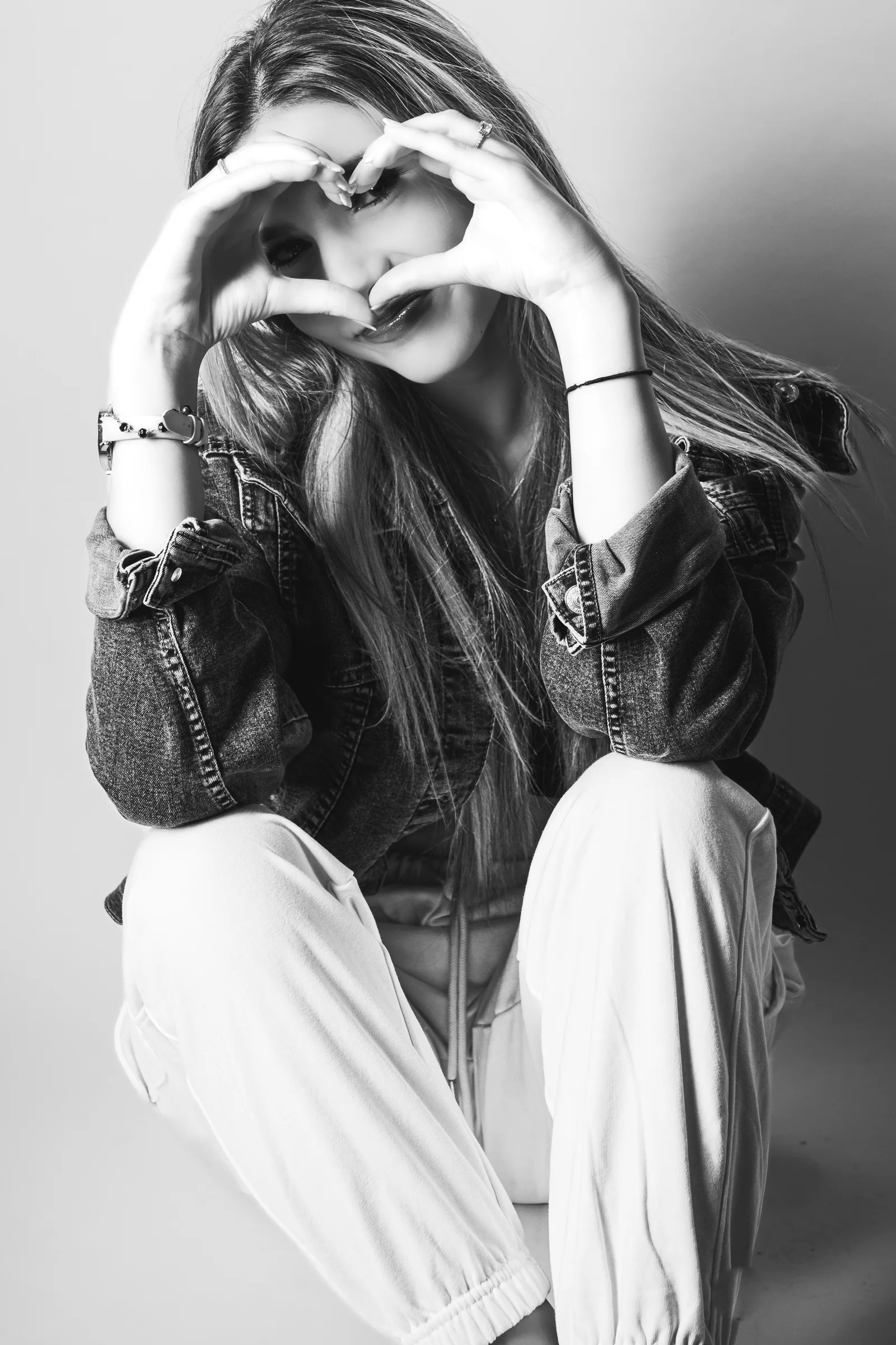 Expressive black and white seated portrait