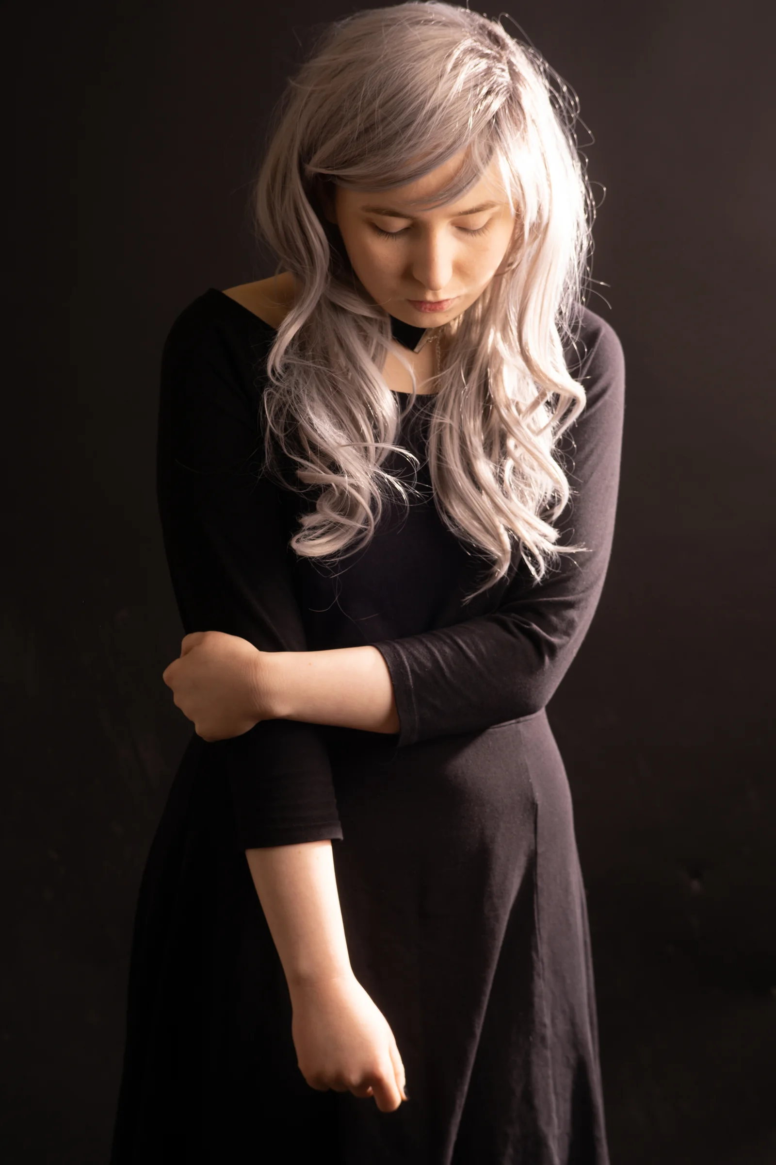 Low key portrait woman black dress