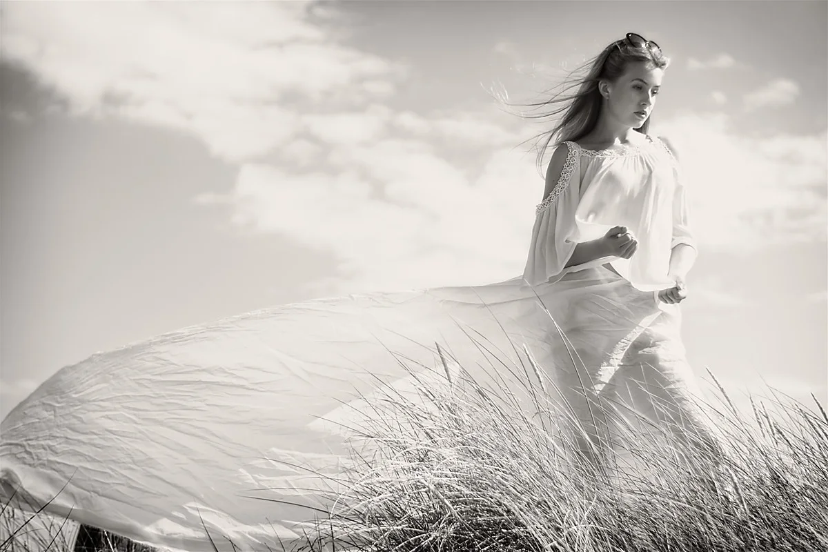 Monochrome outdoor portrait in a flowing dress